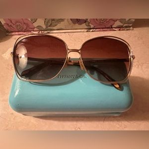 Tiffany and Co. authentic sunglasses medium size frame with jewels and logo.